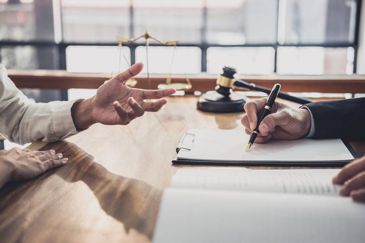 Consultation and conference of professional businesswoman and Male lawyers working and discussion having at law firm in office.
